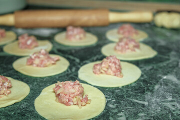 cook in the kitchen to prepare delicious healthy khinkali