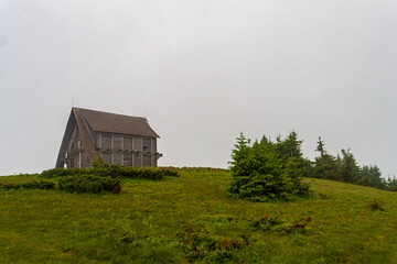 Fototapeta premium Lonely house on top of a mountain