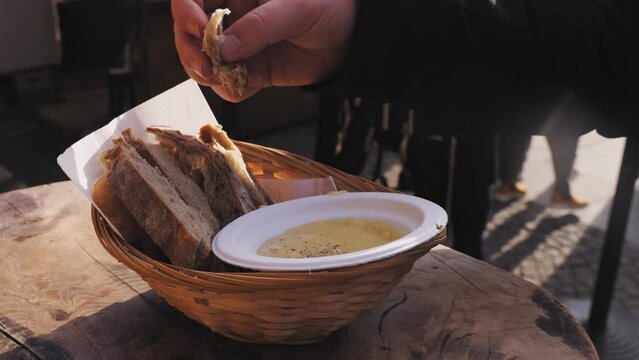 Close up of Swiss cheese fondue with bread on a Christmas market in Europe
