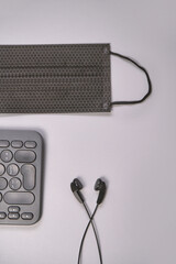 Podcast concept. Black microphone recorder, content notebook keypad with black earphones. Close up. Audio music device. Recording production. School knowledge equipment. Home online teaching. Grey