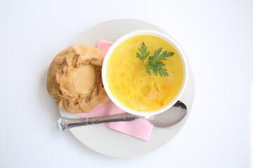 chicken broth in a plate, chicken pie from unleavened dough