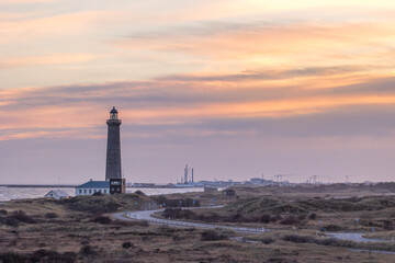 The lighthouse of Grenen at the most northern point of Denmark at sunset at a cold day in spring.