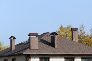 Bitumen roof with four chimneys
