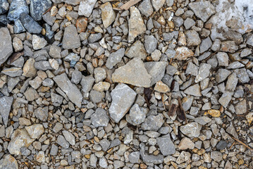 Wet and gray pattern cobblestone forms background