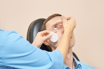ophthalmologist medical patient. eyedrop apply. Eye clinic treatment. Hospital optics equipment....