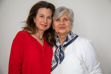 Mother with her daughter looking at the camera outdoor. mothers day celebration