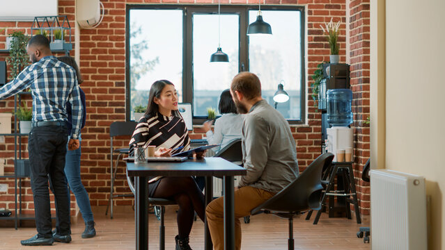 HR employee greeting man with job application at hiring meeting, having resume for recruitment. Female worker talking to applicant at job interview for business career work. Employment offer