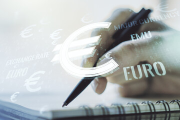 Creative EURO symbols illustration and woman hand writing in notebook on background, forex and currency concept. Multiexposure