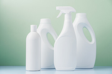 Set of white bottles with cleaning products. Cleaning service concept