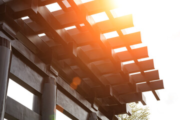 Chinese style wooden torii in a sunny morning