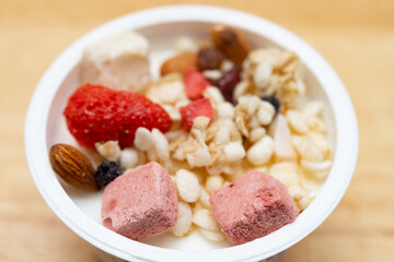 angle view yogurt with nuts and dry fruits and melon seeds