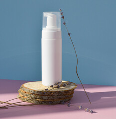 A mock-up of a cosmetic skin care product. The concept of eco-organic cosmetics with natural...