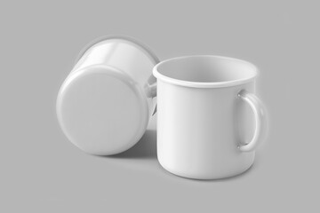Two enamel coffee cups or mugs mockup with copy space for logo isolated over a grey background with clipping path included. 3d rendering. front and side view.