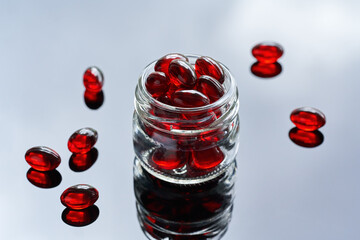 Krill oil pills in a glass jar - healthy nutritional supplement