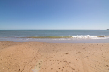 Fototapeta na wymiar Isla Cristina beach, Huelva, Spain. A blue sky and fine sand. Concept of the best beaches.