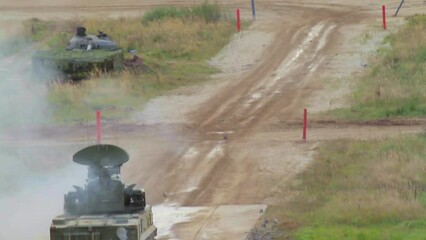 Tanks and combat complexes conduct firing drills at the Russian training ground.