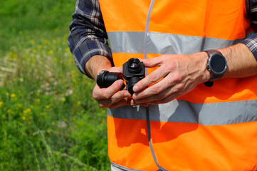 Operator hands holding a dual lenses camera for quadcopter