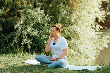 Breathing exercise, yoga and meditation practice. Caucasian young woman breathing with one nostril,...
