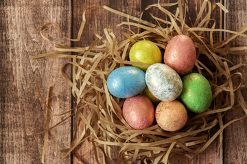 Colorful easter eggs on wooden background. . Happy Easter background.