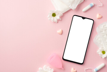 Top view photo of smartphone pink hearts camomile buds menstrual cup hygienic pads and tampons on isolated pastel pink background with blank space