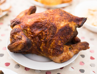 whole roasted chicken on a plate