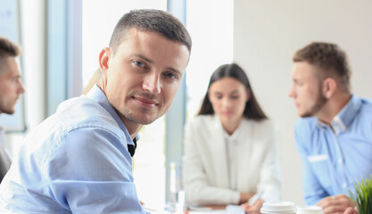 Fototapeta premium Businessman with colleagues in the background in office.