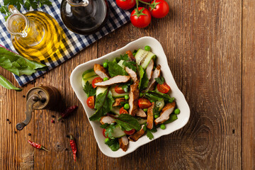 Delicious salad with grilled veal, beetroot and cucumber. Top view.