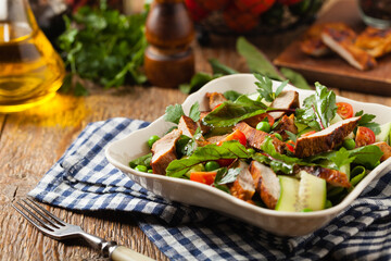 Delicious salad with grilled veal, beetroot and cucumber. Front view.