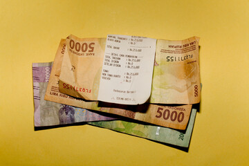 Coins change on the receipt. Indonesian rupiah currency