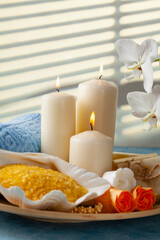 Fototapeta na wymiar Candles and an intimate atmosphere. SPA accessories.