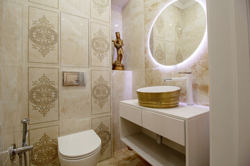 A toilet room with a bathtub, a mirror, a toilet, and a sink, a very necessary room in any apartment