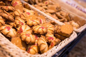 crispy cookies in wicker baskets on the counter