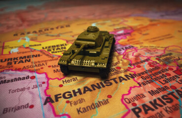 Toy tanks on the map. Armed conflict in the Middle East In Afghanistan.