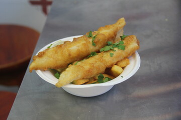 Grilled fish served with fries 