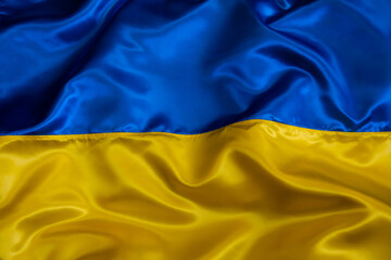 Silk waving Ukrainian national flag background