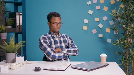 Fototapeta premium Displeased analyst crossing arms and showing disappointment, disagreeing with business decision. Upset worker closing laptop computer after finding bad information about office job.