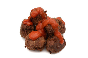 Fried meatballs covered with tomato sauce, isolated on white background.