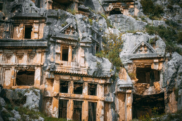 The rock-cut tombs chambers on the south-west slope of the Acropolis. Myra Ancient City. Lycian Tombs. Demre, Antalya, Turkey.