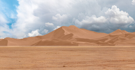 Fototapeta na wymiar Panoramic view of desert plains in Namibia Africa with hills and mountains in the background