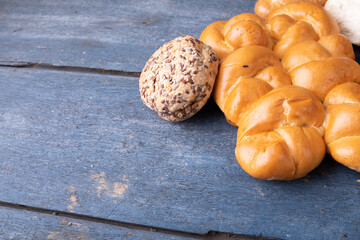 Close-up of baked buns on wooden table
