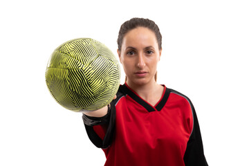 Portrait of confident caucasian young female sports player showing handball against white background