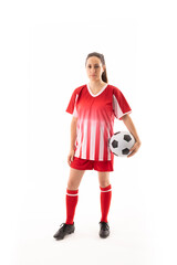 Full length portrait of caucasian young female soccer player with ball against white background