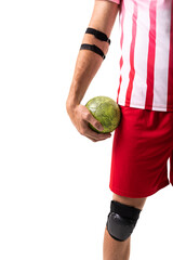 Midsection of young male caucasian handball player holding green ball against white background