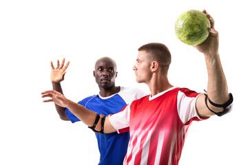 Multiracial rival handball players playing against each other over white background