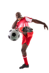 Confident african american male athlete kicking soccer ball on white background