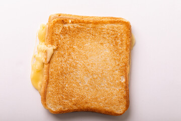 Directly above view of fresh cheese toast sandwich over white background