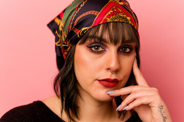 Young caucasian makeup artist woman isolated on pink background
