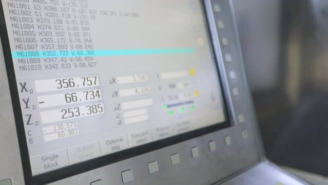CNC machine monitor. Control panel of cnc machine in factories. Modern CNC machine. CNC machine processes a metal part