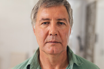 Obraz premium Close-up portrait of serious caucasian senior man at home