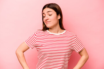 Young caucasian woman isolated on pink background dreaming of achieving goals and purposes